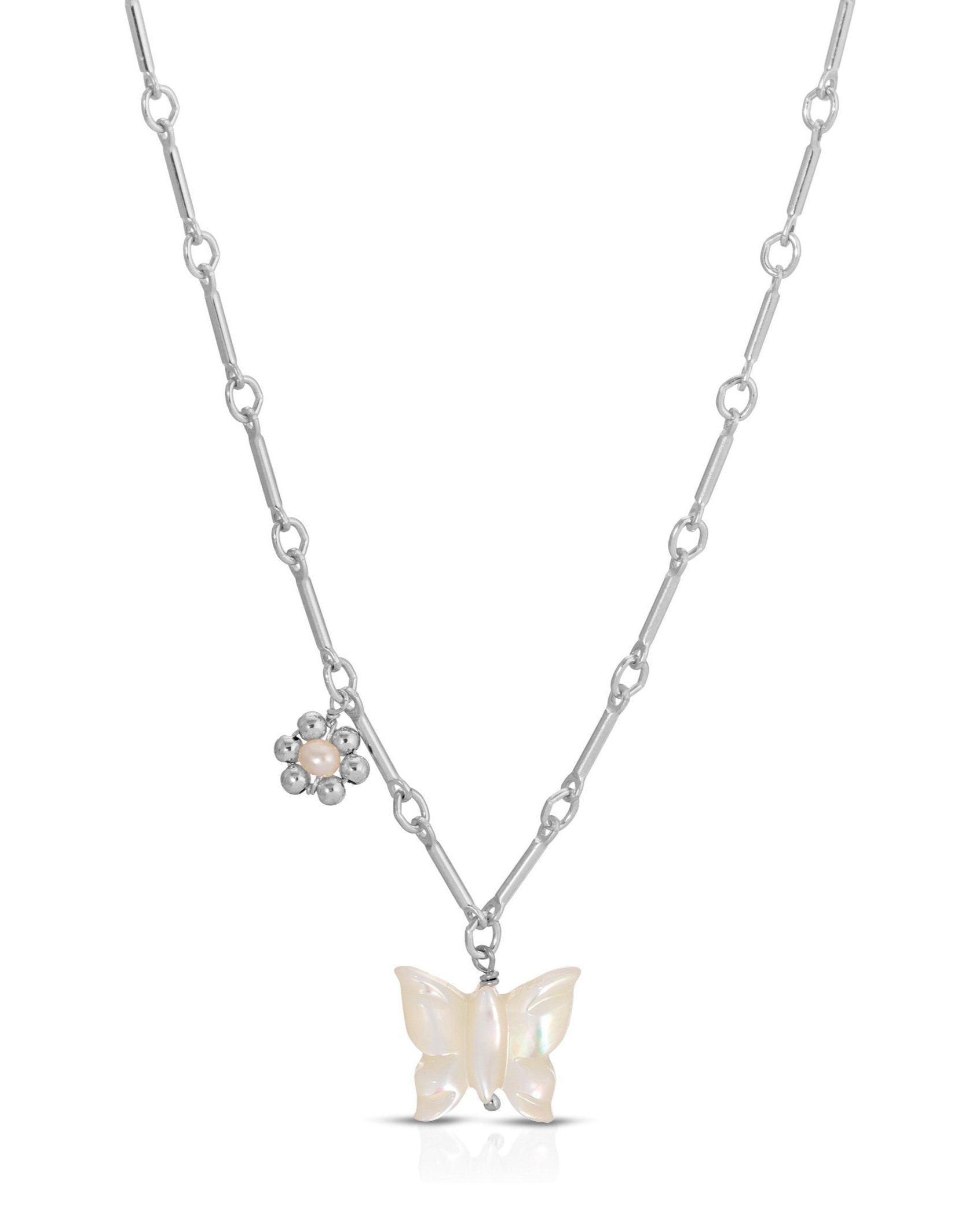 Tinley Necklace by KOZAKH. A 16 to 18 inch adjustable length necklace, with flat cable chain on top half and bar link chain on bottom half, crafted in Sterling Silver, featuring a hand-carved Mother of Pearl butterfly charm and a handmade silver beaded daisy with 2mm pearl in the center.